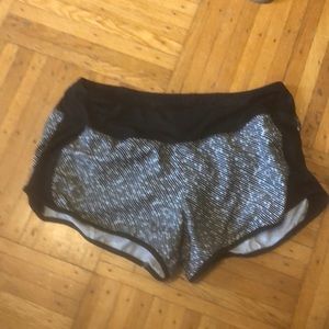 Black and white Nike running shorts